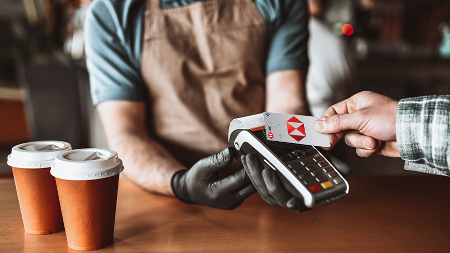 Customer paying via contactless debit card; image used for HSBC Vietnam Debit Card page