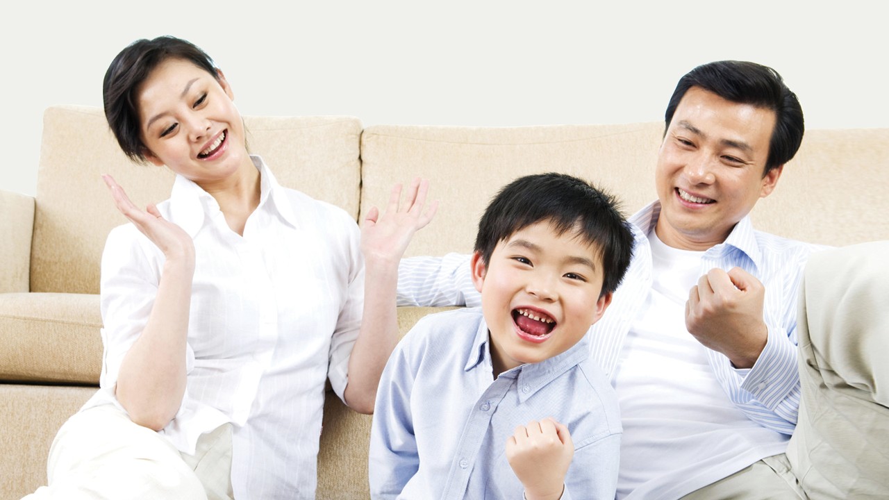 Boy and parents on sofa; image used for HSBC Vietnam Home insurance page