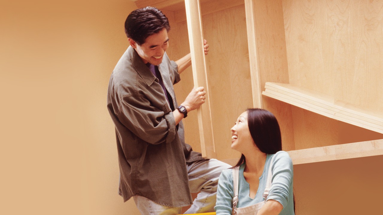 Couple assembling furniture; image used for HSBC Vietnam Personal Safety Insurance page