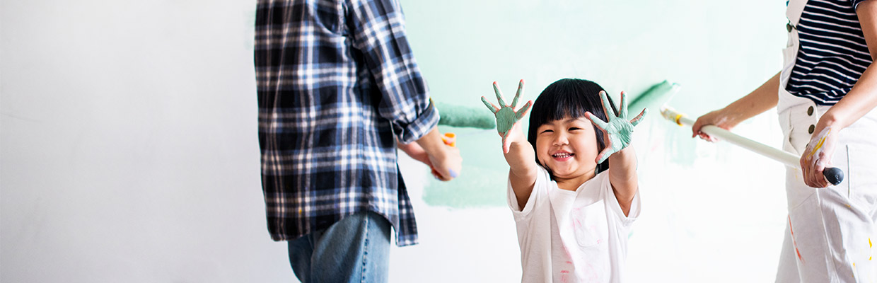 Son and parents painting a room; image used for HSBC Vietnam Home Equity Loan page