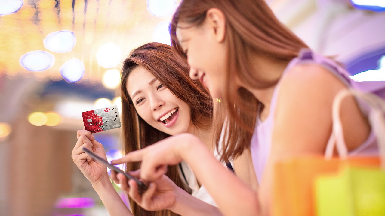 Female friends shopping together using an HSBC debit card