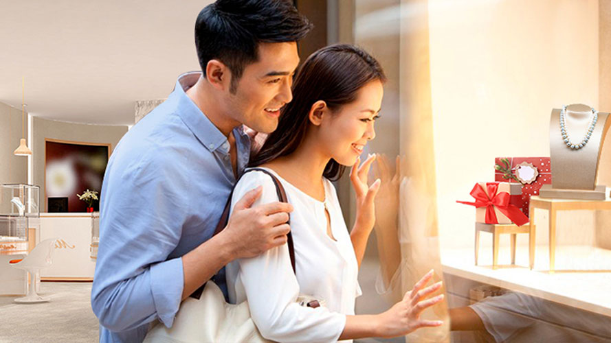 a young couple checking bills in front of a laptop; image used for HSBC VN Bill Payment page