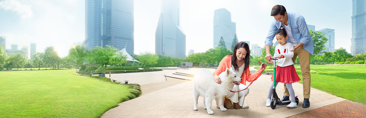 Happy young family in flower field; image used for HSBC Vietnam Life Insurance Offer page