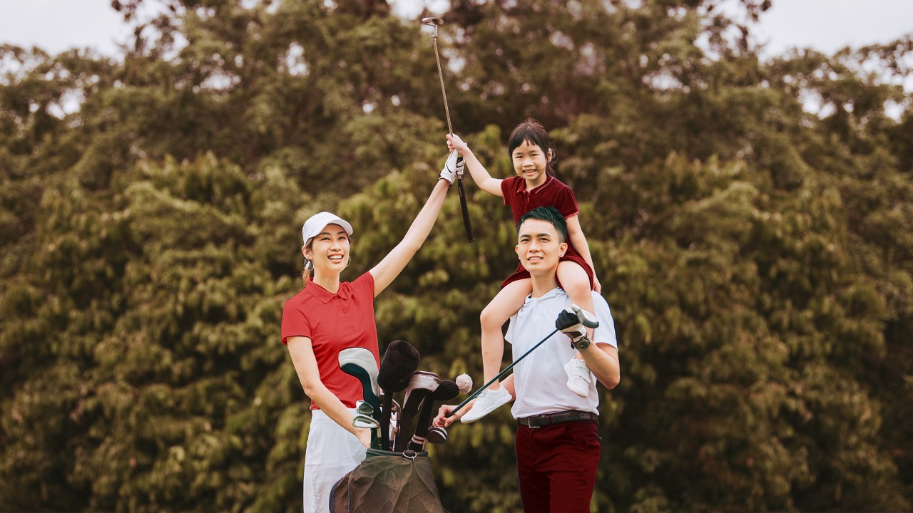Family of four smiling happily; image used for HSBC Vietnam Premier page