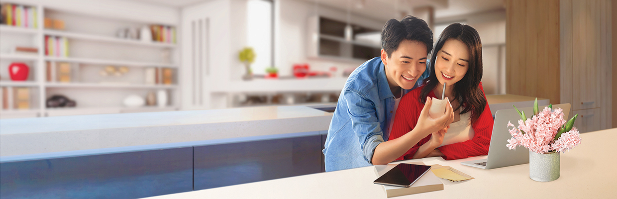 a young couple checking bills in front of a laptop; image used for HSBC VN Bill Payment page